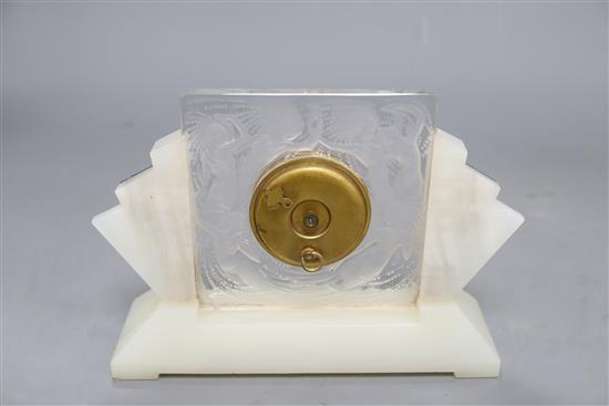 A Lalique Art Deco onyx and frosted glass mantel timepiece, with enamelled dial, height 14cm